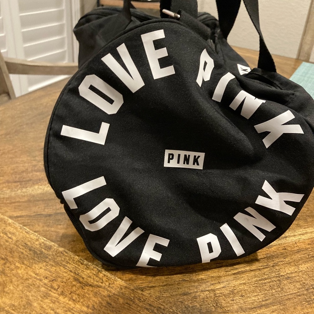 Pink duffle bag, black and white